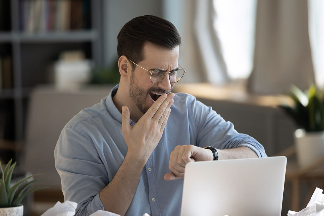 man tired from work with a potential employee engagement problem