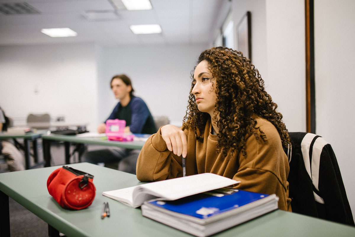 women bored at work during a poor employee training session